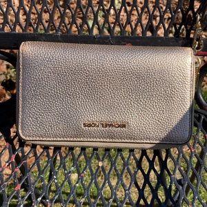 Michael Kors woman’s gold wristlet RUC
